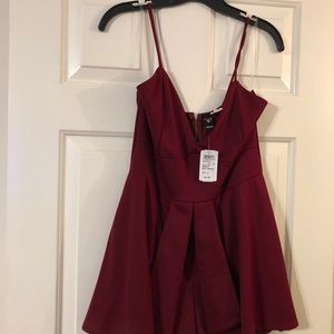 NWT romper with skirt detail in front size large